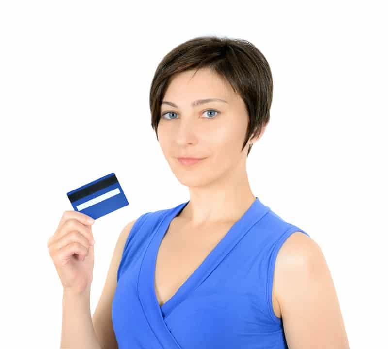 Young woman holding a blue rewards credit card