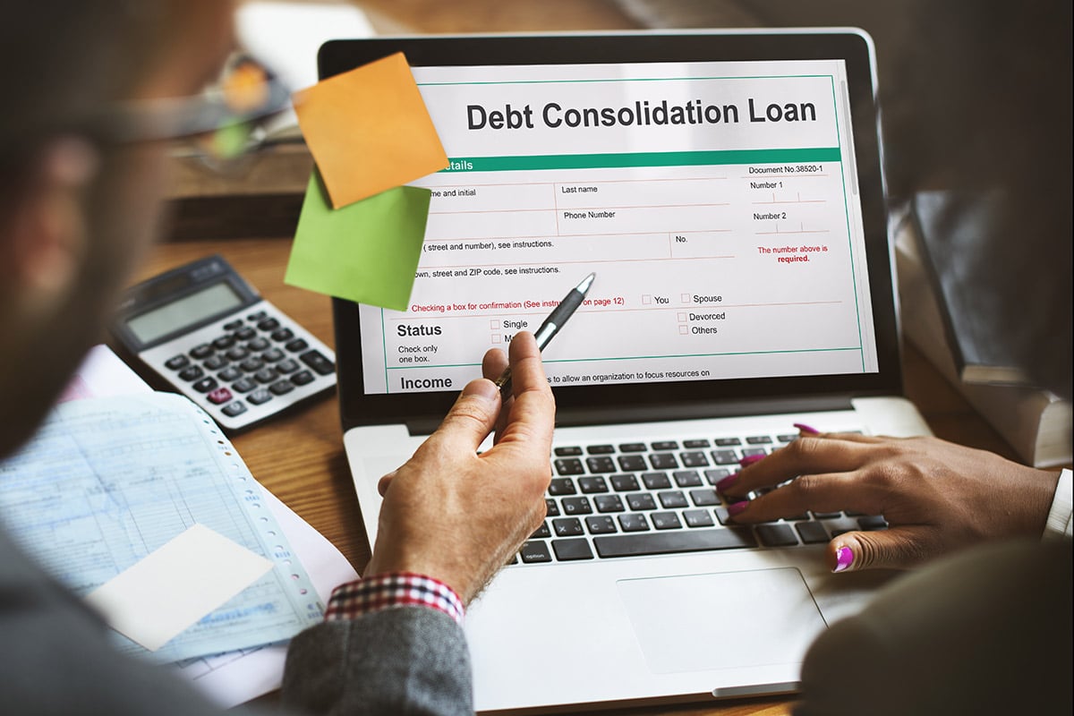 Couple reviews a debt consolidation loan online