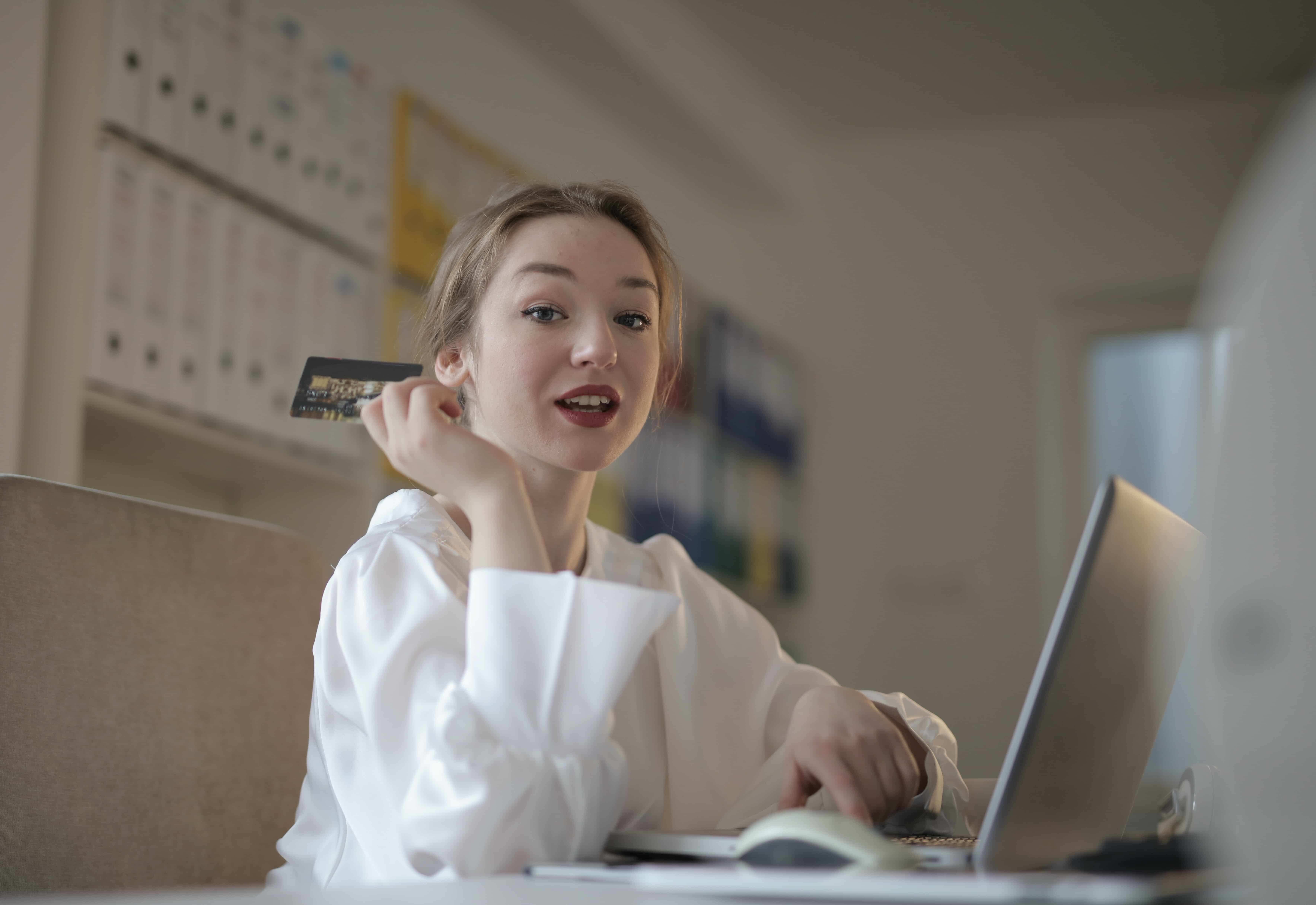 Girl holding a credit card